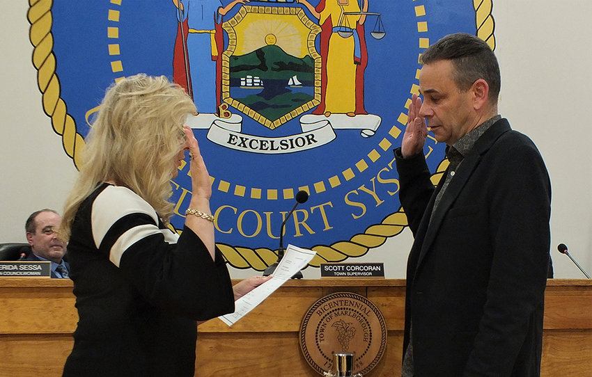 Marlborough Town Clerk Colleen Corcoran administers the oath of office to Councilman Dave Zambito.