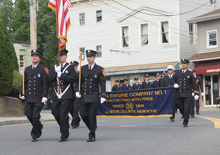 Milton firefighters marching in the Marlboro Fire Parade, July 2022.