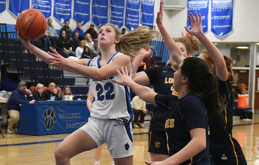Wallkill&rsquo;s Zoe Mesuch goes up to the basket as Our Lady of Lourdes&rsquo; Madison Eighmy (30) and Simone Pelish defend during Thursday&rsquo;s MHAL Division I girls&rsquo; basketball game at Wallkill High School.