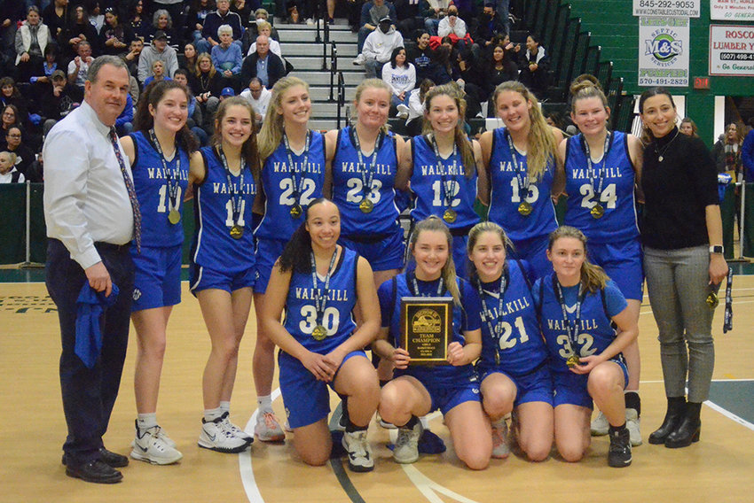The Wallkill girls' basketball team poses after winning the Section 9 Class A championship by beating the Cornwall Dragons on March 3 at SUNY Sullivan. The Panthers will move into Class AA when the NYSPHSAA goes into six classes starting in 2023-24 in baseball/softball, soccer, volleyball and basketball.