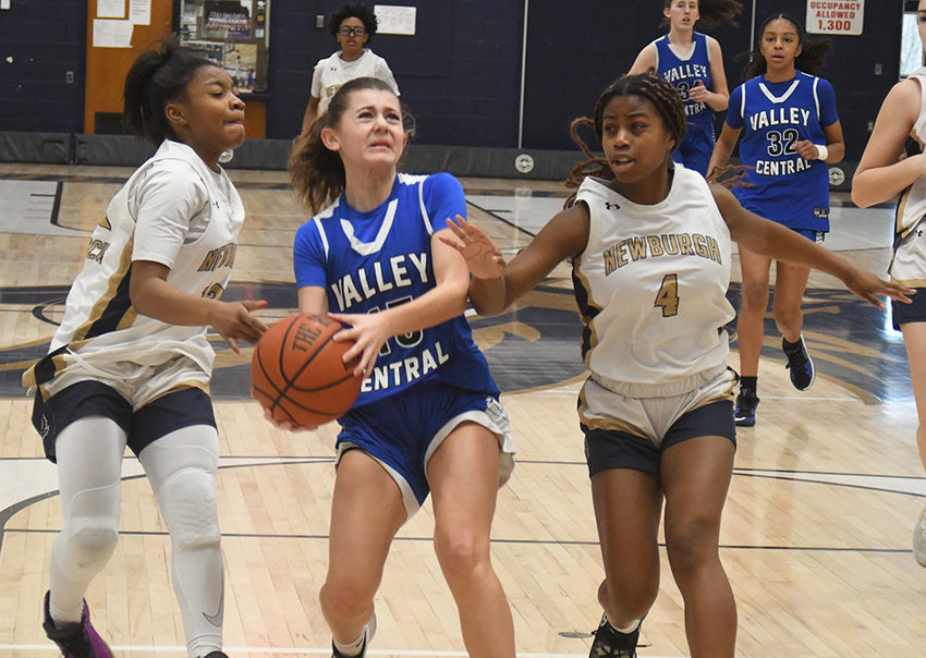 Valley Central&rsquo;s Kelly Schmidt goes to the hoop as Newburgh&rsquo;s Terri&rsquo;nashjae Burden and Desirae Rice (4) defend during Saturday&rsquo;s OCIAA crossover girls&rsquo; basketball game at Newburgh Free Academy.