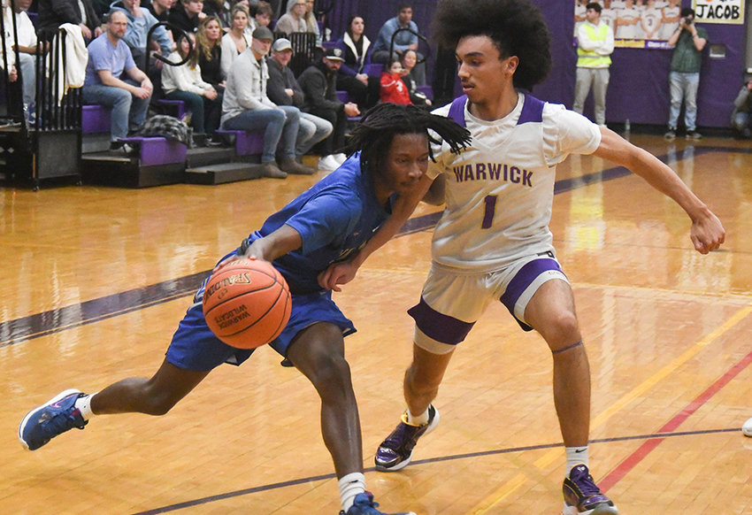 Valley Central's Jerrell Taylor drives the basketball as Warwick's Jacob Gonzalez defends during Wednesday's OCIAA Division II boys' basketball game at Warwick Valley High School.