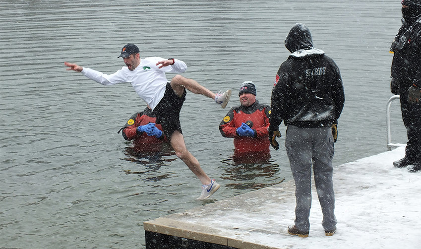 A brave soul takes a plunge into the icy waters of Berean Lake, Saturday, during the annual event sponsored by the Hudson Valley Chapter of the Alzheimer&rsquo;s Association.