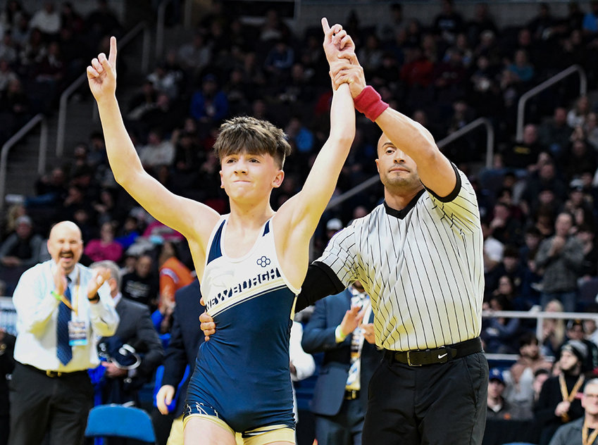 Newburgh&rsquo;s Cooper Merli is declared winner and state champion after defeating Hauppague&rsquo;s Connor Sheridan in the 102-pound final.