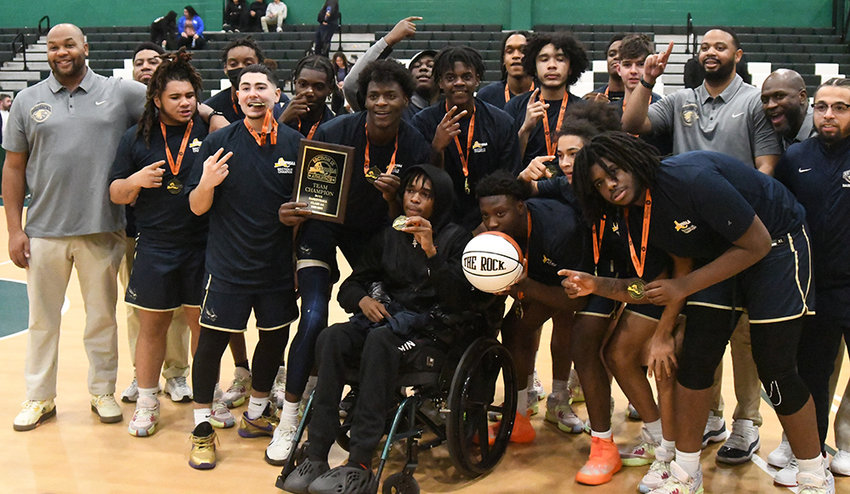 The Newburgh Free Academy Goldbacks pose after winning the Section 9 Class AA championship with a 52-42 win over Middletown on Thursday at SUNY Sullivan.
