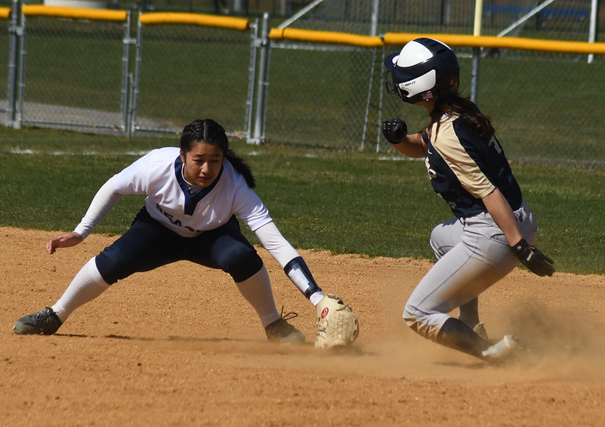Newburgh&rsquo;s Marissa Scarano pops out of her slide as Beacon shortstop Kat Ruffy applies the tag during a non-league softball game on April 4 at Beacon High School.