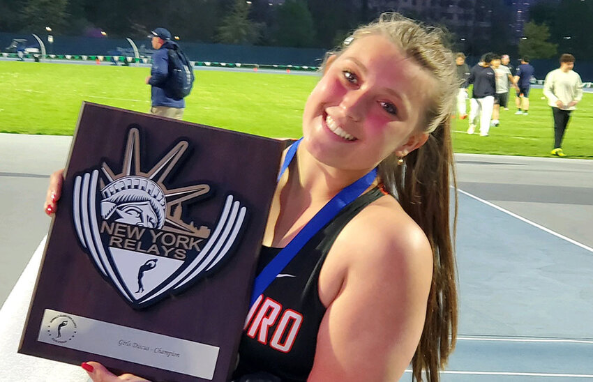 Marlboro&rsquo;s Juliana Juras holds the discus championship plaque at the New York Relays at Icahn Stadium on Friday in New York.
