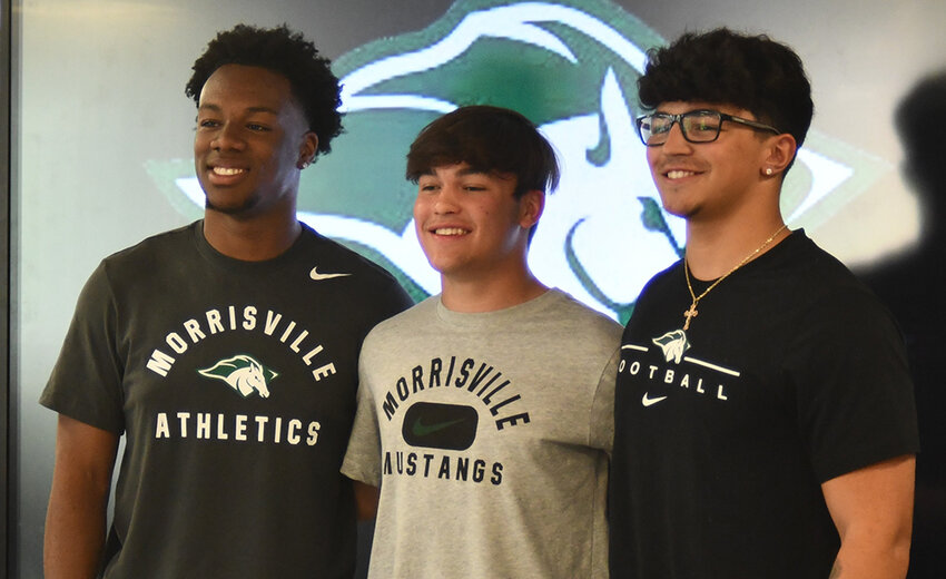Wallkill's Sean Perrin, Mason Ondreyko and Gabe Crespi are shown after officially signing to play football at SUNY Morrisville on May 9 at Wallkill High School.