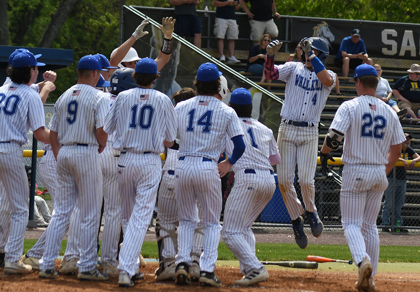 The Wallkill Panthers celebrate Brandon Vesely's three-run home run during Saturday's MHAL championship baseball game at Cantine Field in Saugerties.