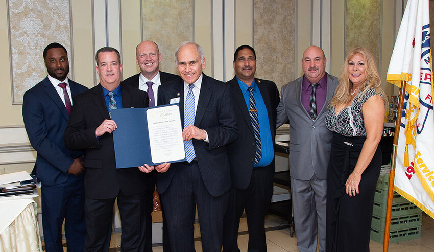 Assemblyman Jonathan Jacobson presented an assembly citation to Middle Hope and was joined by Councilman Scott Manley for a photo.