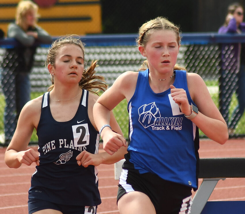 Wallkill's Caitlyn Murphy leads Pine Plains' Violet Bliss in the 3,000-meter run during Friday's MHAL track and field championship meet at Rondout Valley High School in Accord.