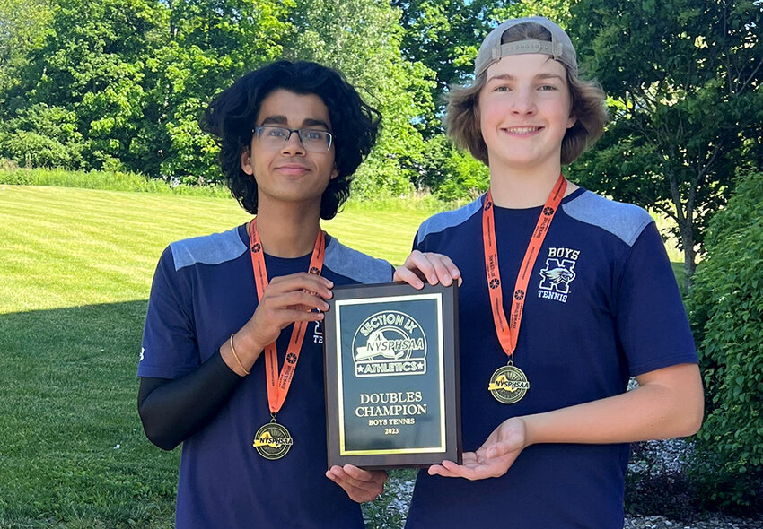 Newburgh&rsquo;s Aarav Shah and Henry Goings-Perrot pose with their medals and championship plaque after winning the Section 9 boys&rsquo; tennis doubles championships on Thursday at MatchPoint Tennis Center in Goshen.
