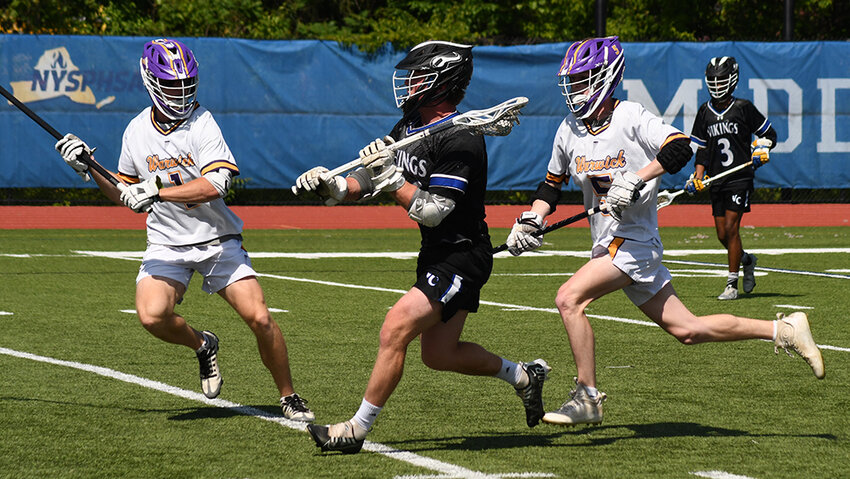 Valley Central's Danny Latimer brings the ball up the field as Warwick's Anthony Matta and Declan McCurdy defend during Saturday' s Section 9 Class B boys' lacrosse championship game at Faller Field in Middletown.