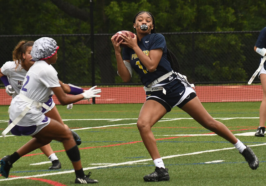 Pine Bush's Ketura Rutty hauls in a pass in front of Warwick's Brianna Brookins during Wednesday's Section 9 championship flag football game at Goshen High School.