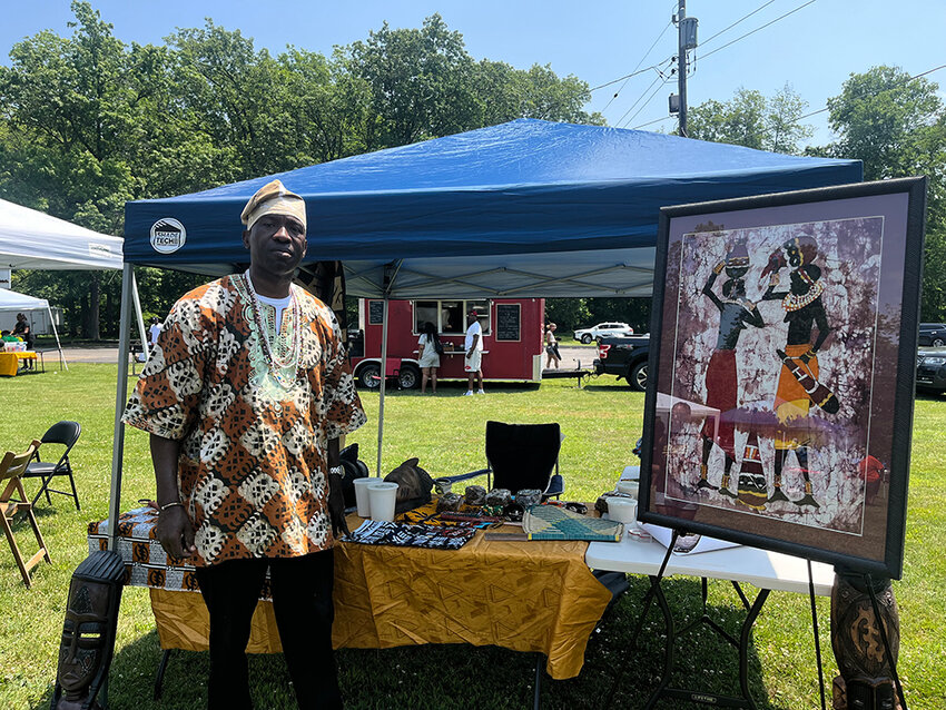 Baba Terry in front of his booth at the Juneteenth celebration He&rsquo;s a part of the African Cultural Center in Newburgh, where they host cultural events and other receptions.