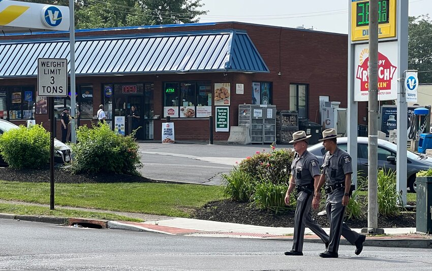 New York State Troopers walked the perimeter of the Valero Gas Station along Lake St as reports of an attempted robbery were unfolding.