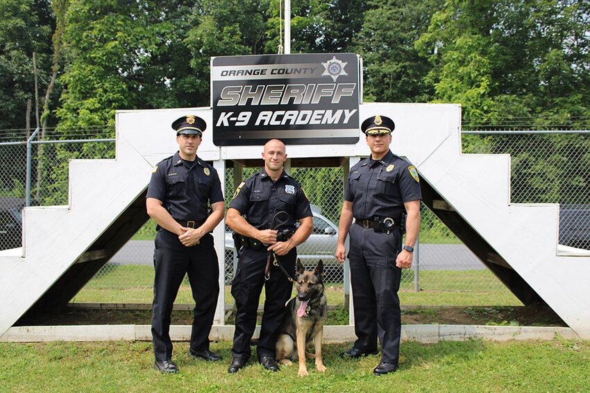 K9 Marty with (l. - r.) Lt. Matthew  Monahan, Officer Brian Levy and Chief Daniel Valeri.