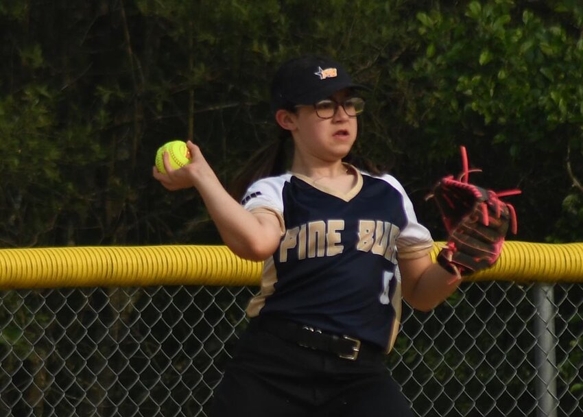 Pine Bush third baseman Bella Riviera makes a throw to first base during Thursday's District 19 Minors softball game at Woodfield in Washingtonville.