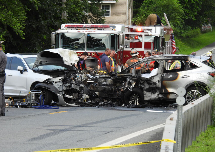 Police and firefighters respond to a head-on collision, Saturday, on Route 52, near the Holiday Trailer Park in Walden.