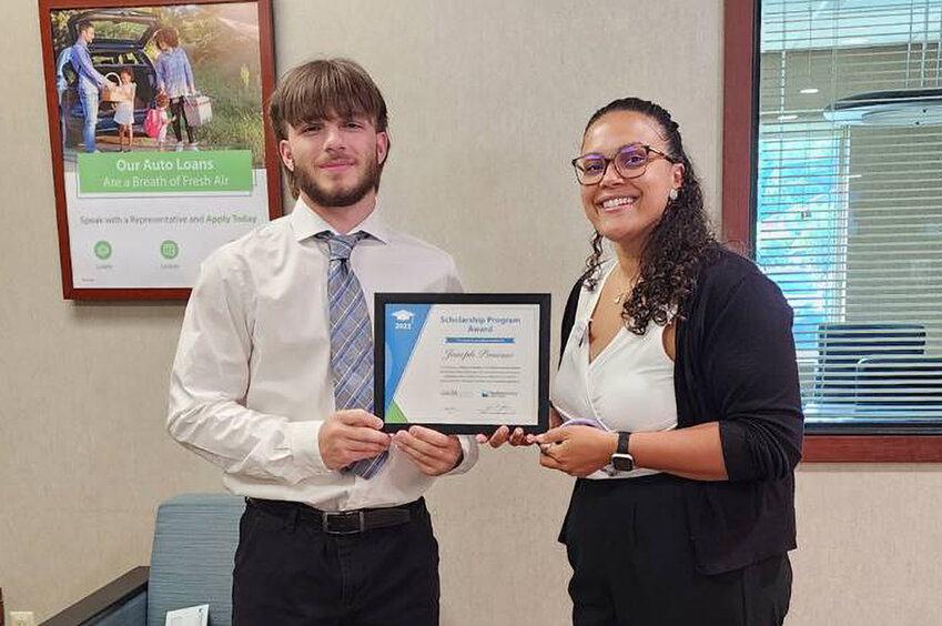 On Monday, July 10,  Branch Manager Victoria LaPorte presented Joseph with his check and award letter.
