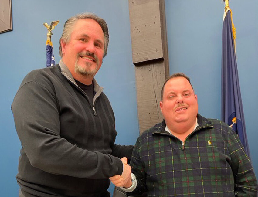 Mayor Dennis Leahy (l.) welcomes David Griffith back in October when Griffith first joined the village as Treasurer. At a village board meeting this week, Griffith moved up to Village Clerk/Treasurer, effective Sept. 5.