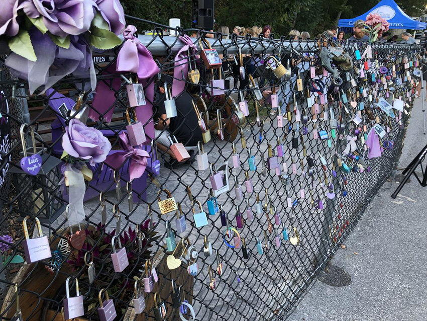 Walden's overdose memorial decorated with padlocks for those lost.