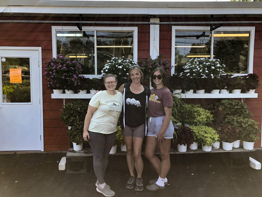 Jessica Scott (left), Kate Loechner (Middle), and Gianna Tocco (Right) standing in front of Stonehenge Farm.