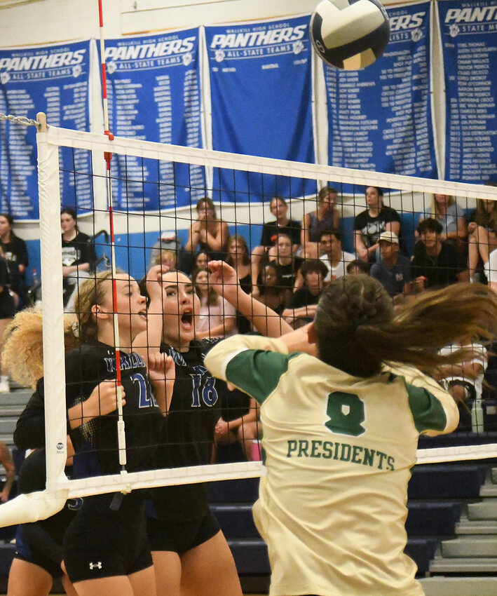 Wallkill's Maddy Stauss and Olivia Yankanin (18) play at the net as FDR's Jaelyn Beyer sends the ball over the net during Thursday's MHAL Division I volleyball game at Wallkill High School.