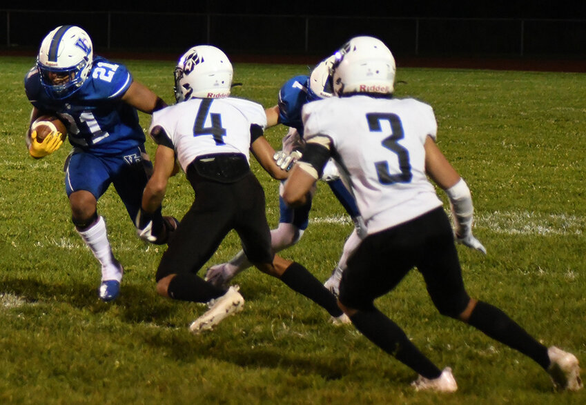 Valley Central's Julian Montrevil runs the football as Wallkill's Kaden Brown (4) and Pablo Acosta (3) look to make the tackle during Thursday's Battle of the Valley football game at Valley Central High School in Montgomery.