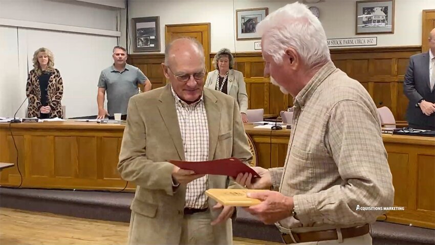 Town Supervisor Ronald Feller handing September&rsquo;s Citizen of the Month certificate and plaque to Jeffrey Crist.