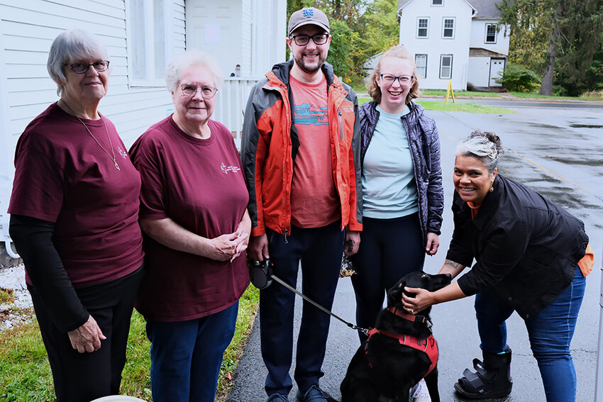 Thomas Townsend-Pitt and Brooke Chadwick brought their dog Padfoot to receive a blessing from Rev. Limina Grace Harmon, as Eileen Daunt and Barbara Terpening look on.