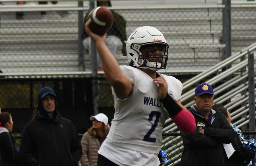 Wallkill quarterback Chris Bartolone throws a pass during Saturday's non-league football game at Warwick Valley High School.
