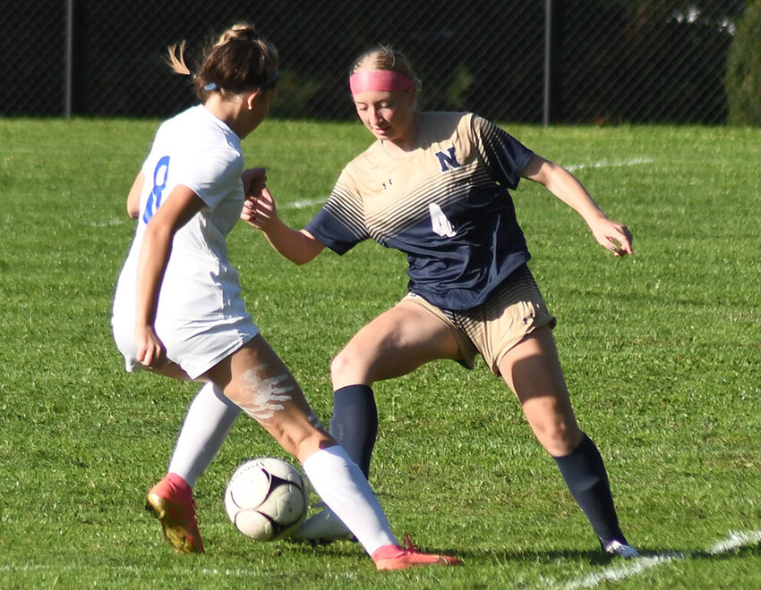 Newburgh's Malia Robinson plays the ball as Valley Central's Samantha Setteducato defends during Thursday's non-league girls' soccer game at Newburgh Free Academy North.