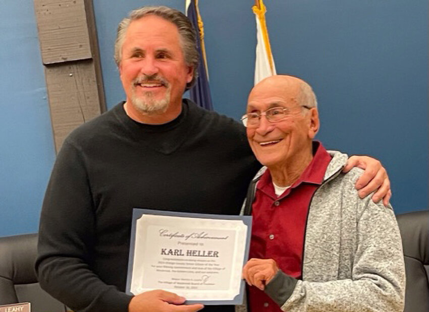 There were smiles all around as Maybrook native Karl Heller (r.) was honored during a recent village board meeting with a certificate of appreciation from Mayor Dennis Leahy (l.) and the rest of the village board.