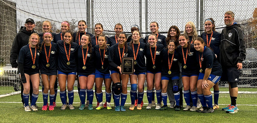The Valley Central girls' soccer team poses with the Section 9 championship plaque after Sunday's Section 9 Class AA championship win at the Hudson Sports Complex in Warwick.