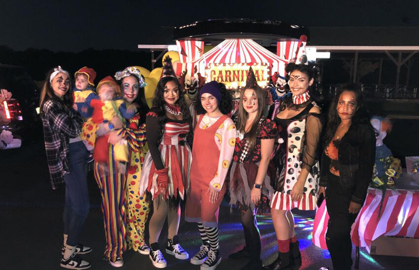 Members of NY Beauty Bar hosting a carnival-themed trunk.