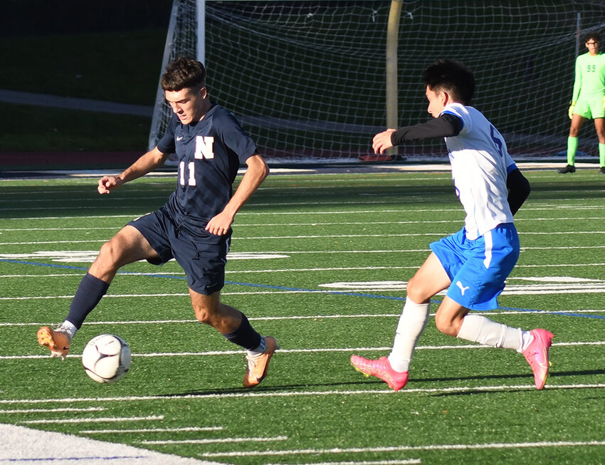 Newburgh's Frank Mandato plays the ball in front of Middletown's Jesus Godinez during an OCIAA Division I boys' soccer game on Oct. 13 at Academy Field in Newburgh.