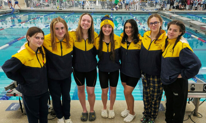 Pine Bush swimmers, from left, Alanah Giannini, Ella Humphrey, Katie Webster, Ashley Martin, Sadie DeGeorge, Maya Oakes and Mackenzie Gula are shown at the NYS Federation girls’ swimming and diving meet on Saturday at the Webster High School Aquatic Center.