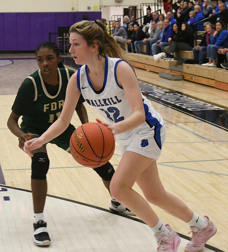 Wallkill&rsquo;s Alex Dembinsky drives past FDR&rsquo;s Asyra King during a Section 9 Class A championship girls&rsquo; basketball game on March 4 at Monroe-Woodbury High School.