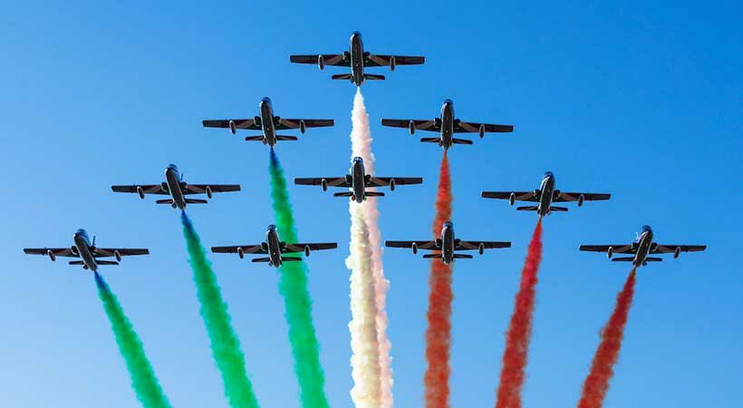 Frecce Tricolori with their signature green, white and red smoke to represent the colors of the Italian flag.