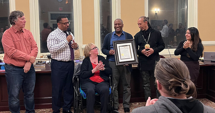 Councilman Anthony Grice (center right) is presented with a citation on behalf of Mayor Torrance Harvey and his council, colleagues thanking him for his service to the city council and the City of Newburgh.
