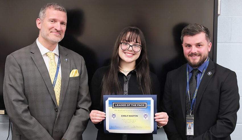 Emily Martin is the December Leader of the Pack for the Highland High School. She is flanked by Principal Kevin Murphy [L] and Assistant Principal Brandon Opitz.