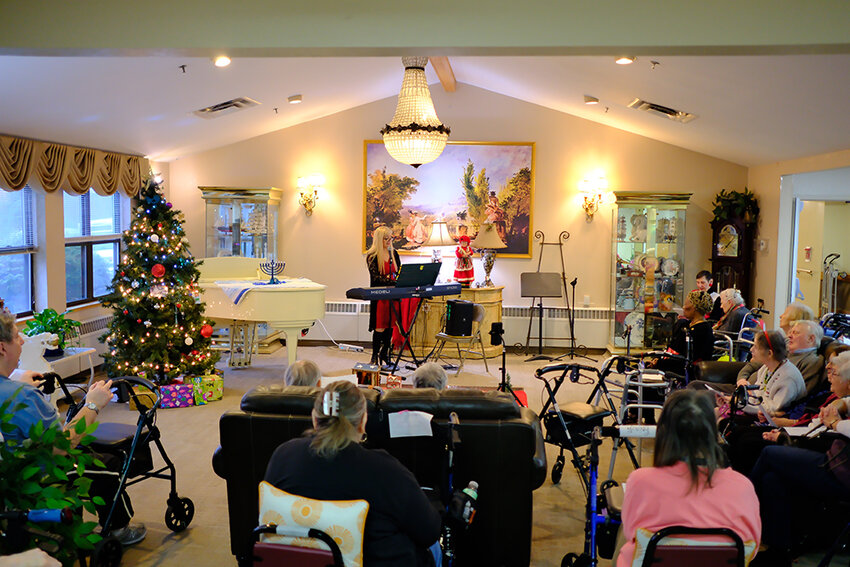 Jennifer Cece entertained the resident of Valley Vista in Highland with a variety of holiday songs.