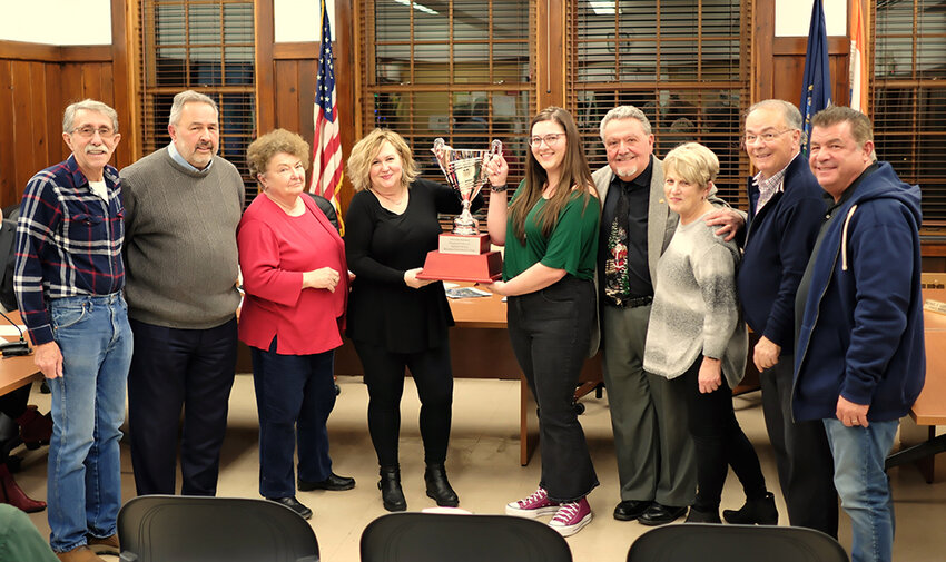 The Lloyd Town Board honored Shelly Collins, owner of Hair Craft Salon, for her holiday window display. Pictured (l. &ndash; r.) Councilman Lenny Auchmoody, Supervisor Dave Plavchak, Elizabeth Decker, Shelly Collins, Julianne Anderson, Councilman John Fraino, Darlene Plavchak, and Councilmen Mike Guerriero and Joe Mazzetti.