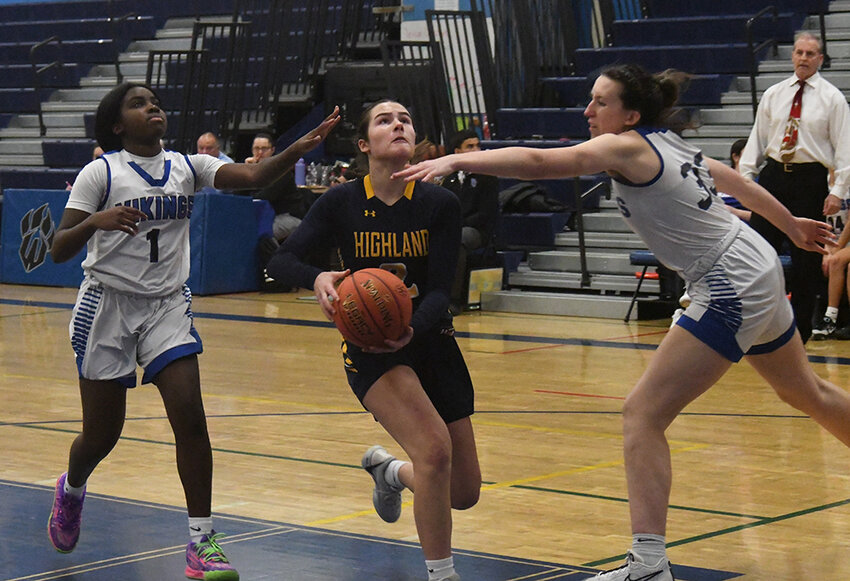 Highland&rsquo;s Grace Koehler prepares to shoot as Valley Central&rsquo;s Maggie Bishopp and Breonna Curtis Wright trail the play during Saturday&rsquo;s Wallkill Coaches vs. Cancer Holiday consolation girls&rsquo; basketball game at Wallkill High School.