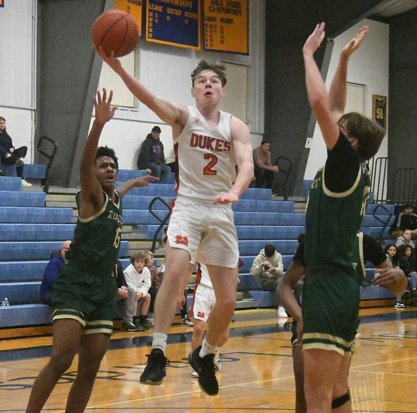 Marlboro&rsquo;s Matthew Ciarimboli goes up for a shot as FDR&rsquo;s Owen Brink, Andrew Parker (15) and Somtochukwu Awaka defend during Friday&rsquo;s seventh-place game of the Duane Davis Christmas Tournament at Our Lady of Lourdes Catholic High School in Poughkeepsie.