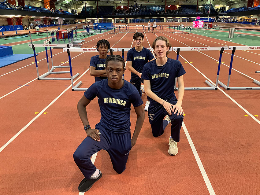 The first-place 3,200-meter relay team of Kendy Georges, Devin Batelic, David Pinnock and Brady Danyluk are shown at the North Shore Invitational in New York City.