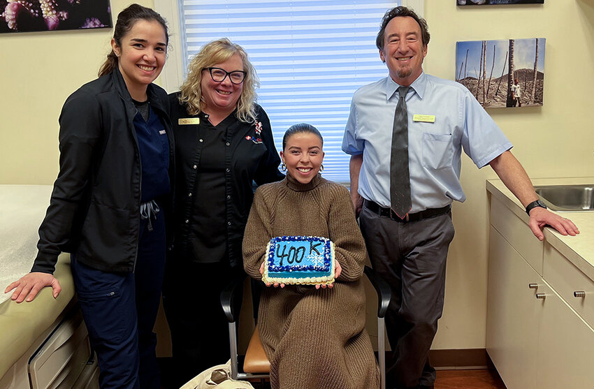 The Highland First Care Medical Center celebrated Nikita Schwab, who is their 400,000th person to come in for an office visit. Pictured L-R Physician Assistant Carly Jobson, Bookkeeper Nicole Hunt, Nikita Schwab and Dr. Stephen Weinman.