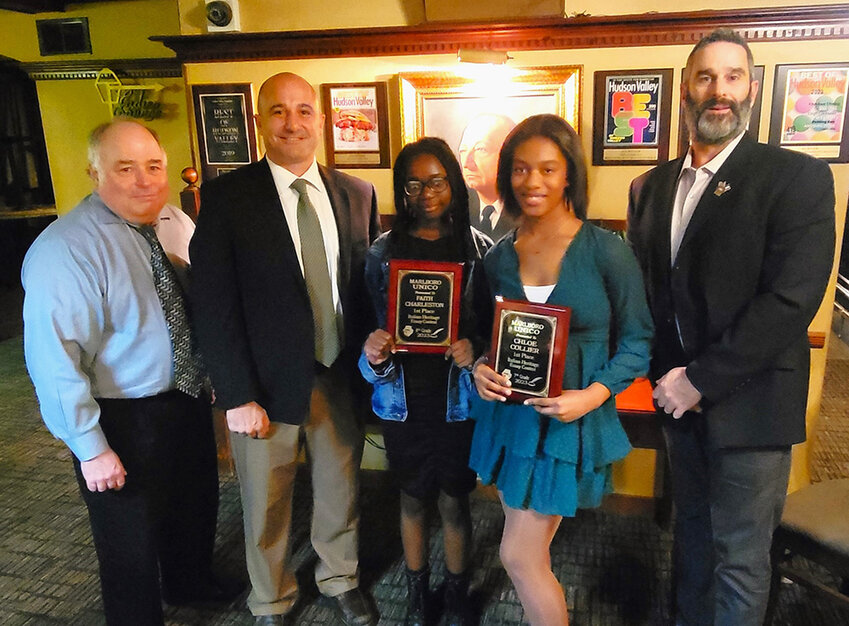 The UNICO Essay Contest winners and their families were honored at a special dinner for their literary achievement. Pictured (l. &ndash; r.)  Nick Johannets, teacher Jim Ventriglia, 8th grade winner Faith Charleston, 7th grade winner Chloe Collier, and teacher Geoff Pesano.
