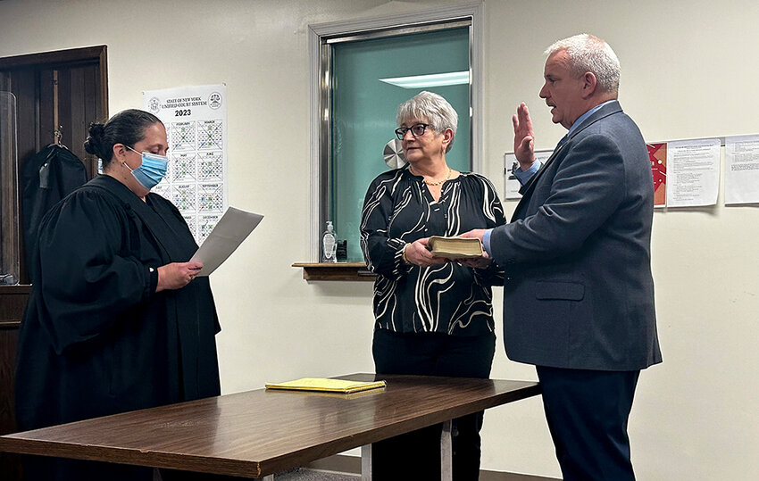 Town Justice Annamaria Maciocia administers the oath of office to new Town of Plattekill Supervisor Dean DePew Sr. Monday at the Town Hall in Modena. DePew&rsquo;s wife Mary Ann witnesses the occasion.
